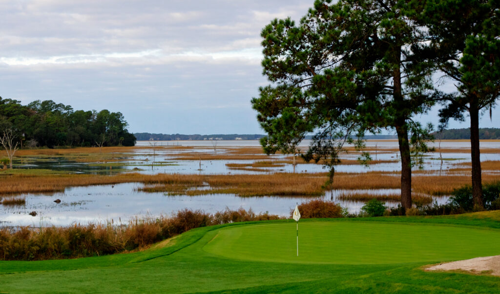 golf fairway along marsh and water at colleton river club, bluffton